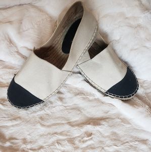 Cream and black flats